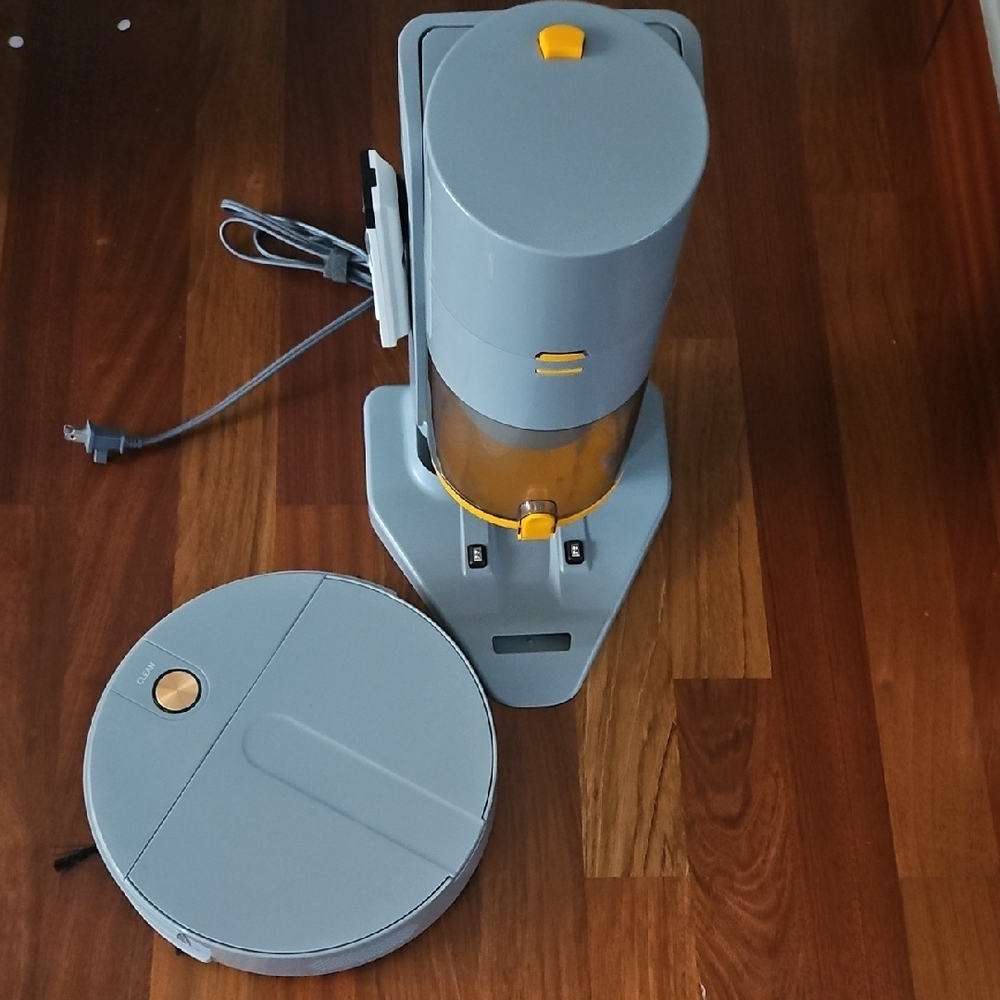 Gray and Yellow Robot Vacuum with Dock